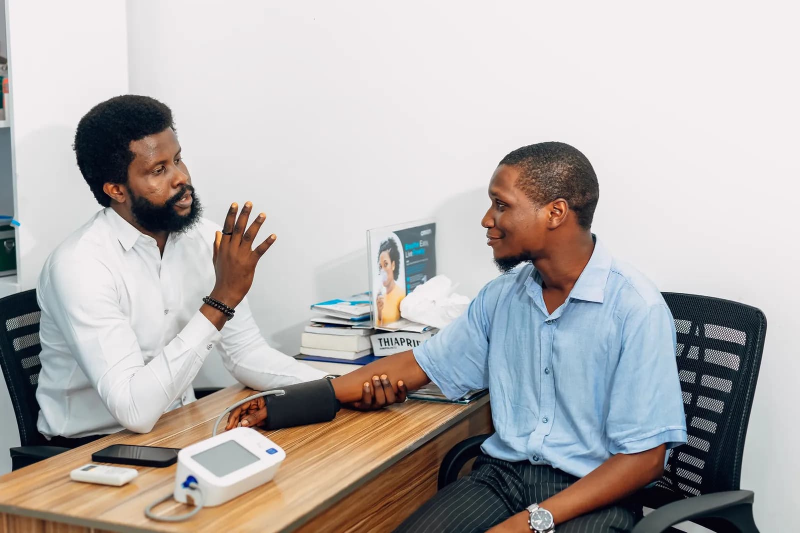 A practitioner and a patient in a consultation room