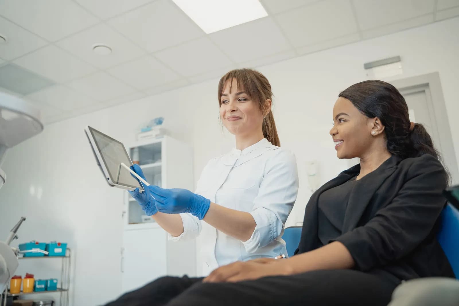 A practitioner going through an X-ray with a patient