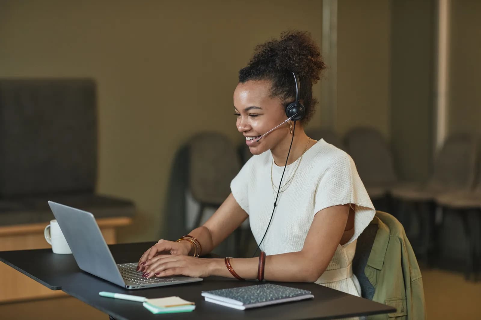 A practice manager working at a laptop
